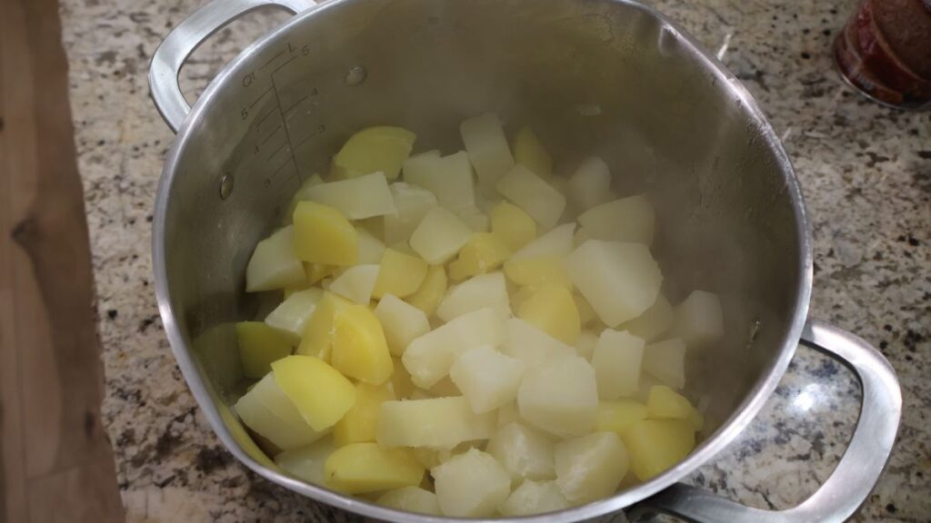 boiled and drained potatoes in a stock pot