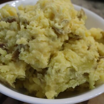 Chunky yukon gold mashed potatoes in serving bowl