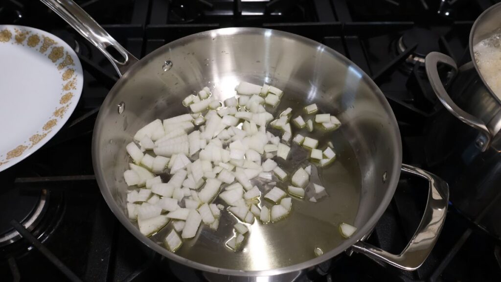 onions sautéing in pan
