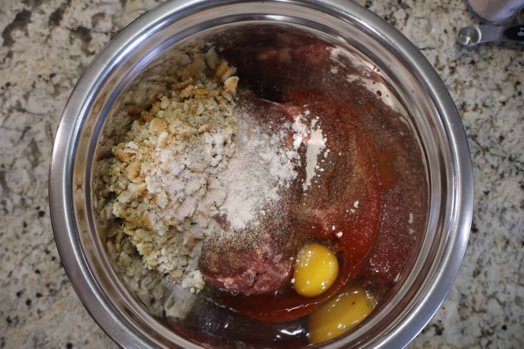 meatloaf ingredients in a large mixing bowl not yet mixed