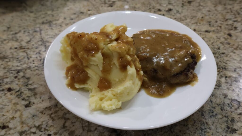 mashed potatoes with gravy and Salisbury steak