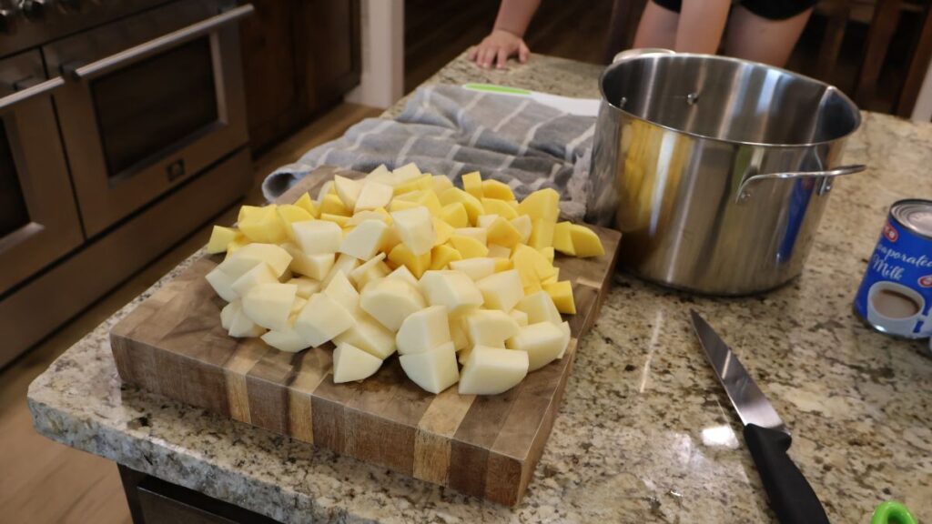 cut potatoes next to stock pot