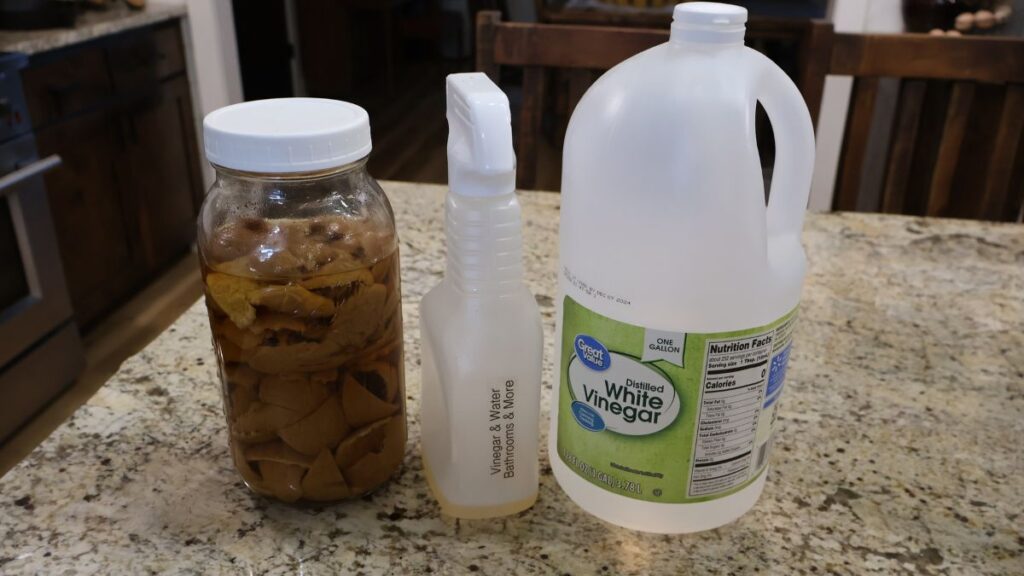 infused vinegar, spray bottle, and white vinegar