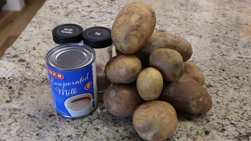 potatoes, evaporated milk, salt and garlic powder displayed