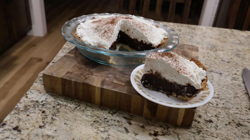 sliced full pie and the pie slice plated from chocolate pie