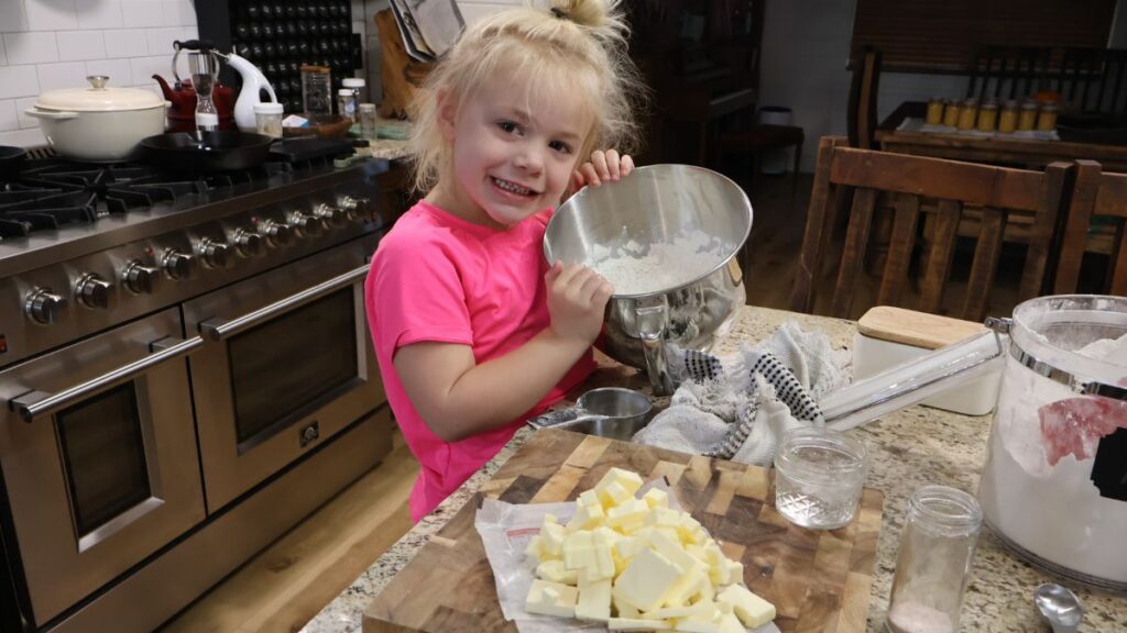 little girl with mixing bowl