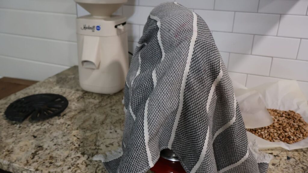 stand mixer covered with towel