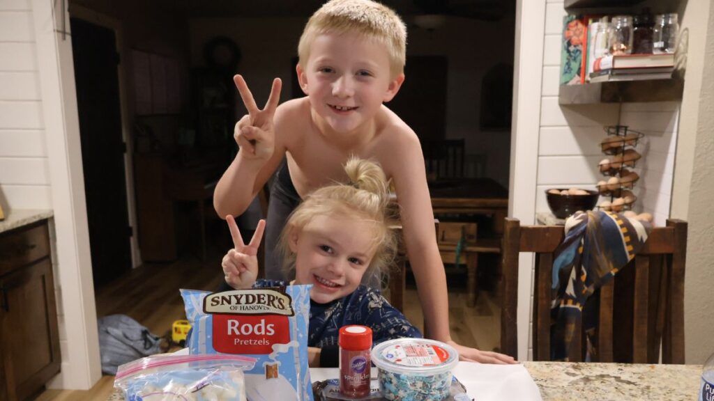 kids holding up a peace sign with ingredients