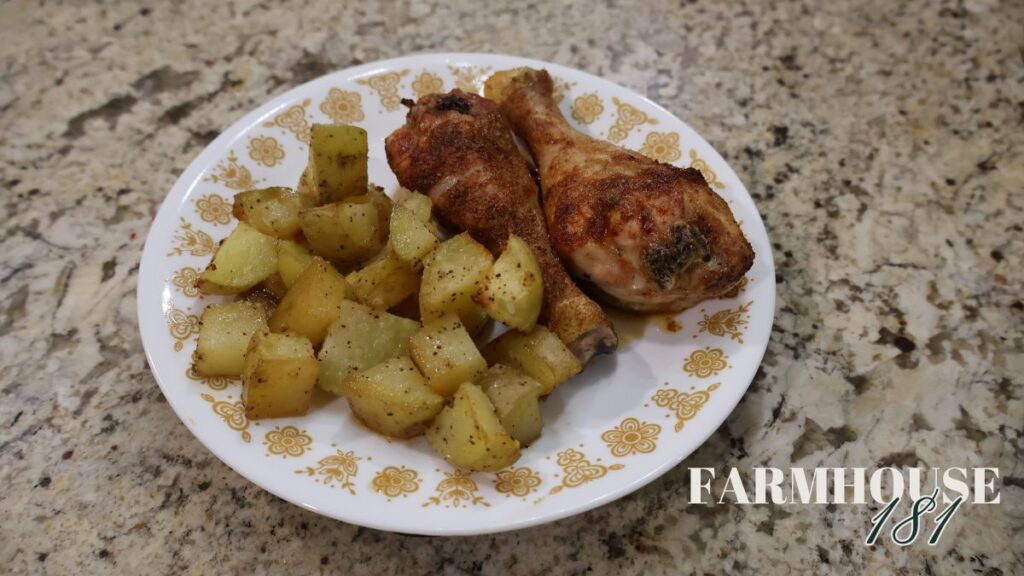 cooked chicken legs and yukon gold potatoes on plate