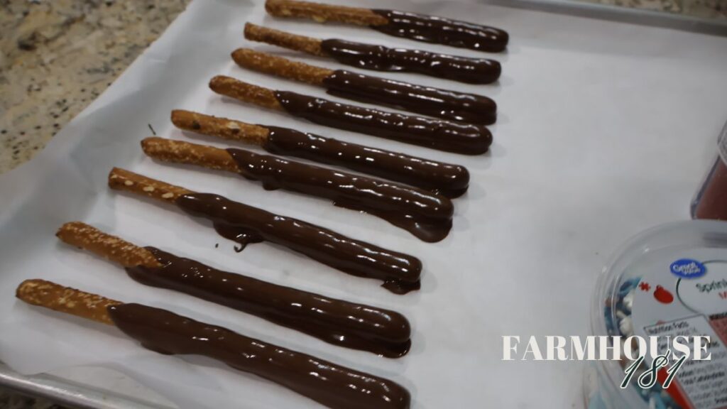 dipped pretzel rods on parchment lined sheet pan