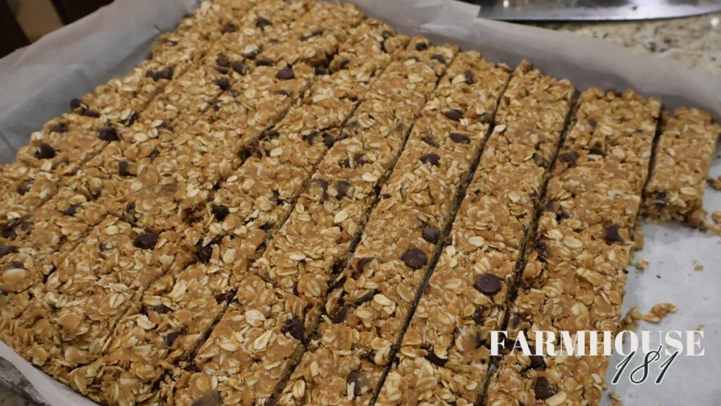cut chocolate peanut butter granola bars on sheet pan lined with parchment paper