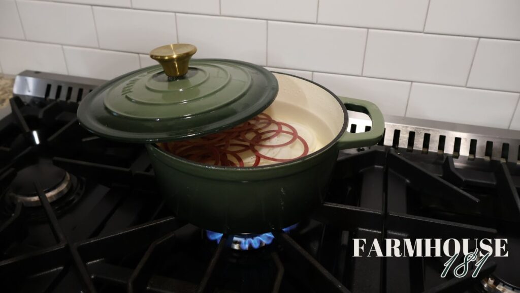 reusable rings and lids simmering in pot