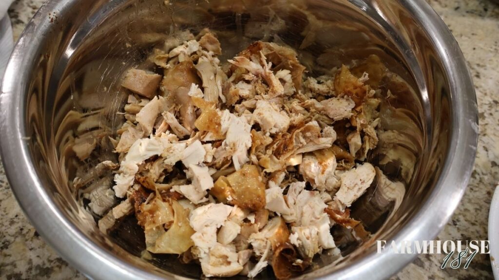 chopped roasted chicken in mixing bowl