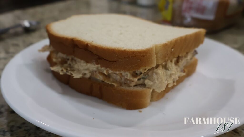 whole chicken salad sandwich on a plate