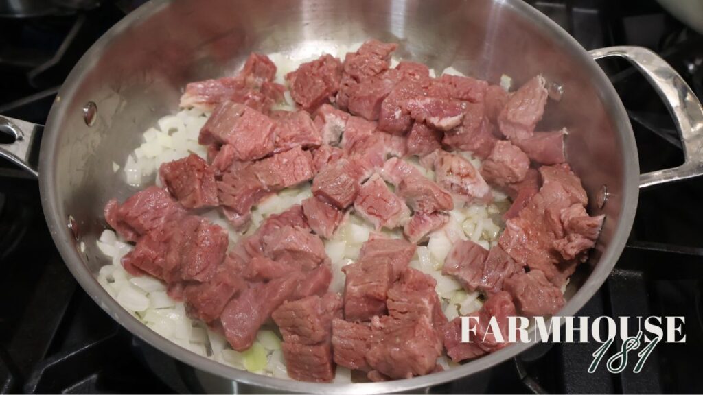 onions and beef browning in skillet