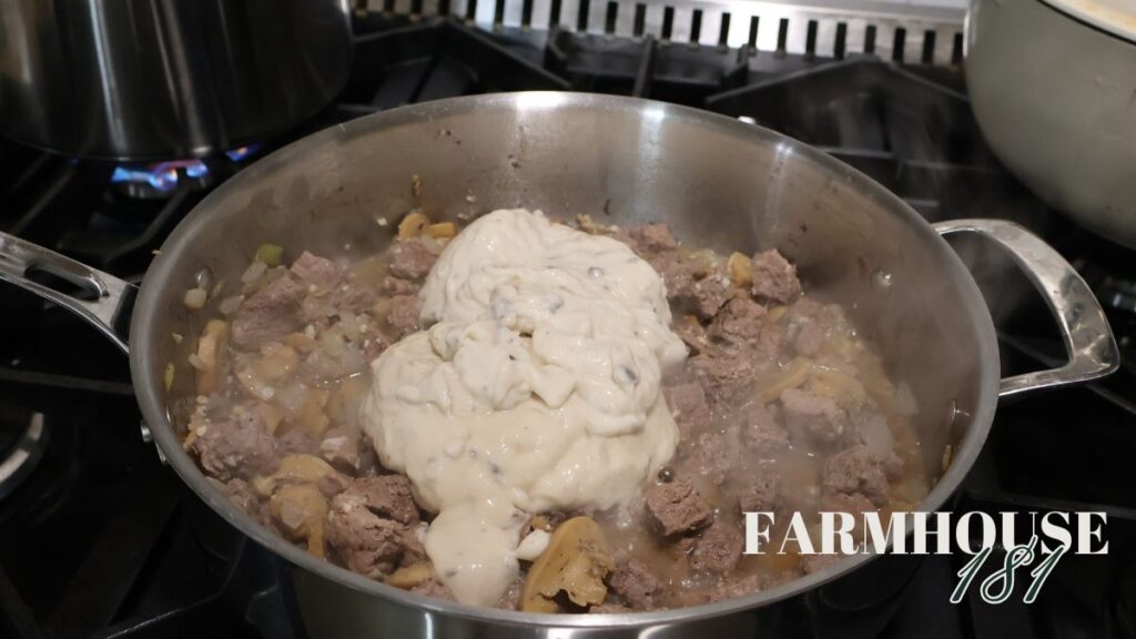 cream of mushroom soup plopped on top of meat in skillet