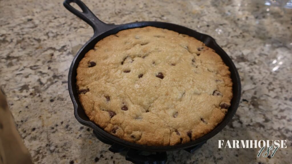 baked chocolate chip cookie dough cake in cast iron skillet