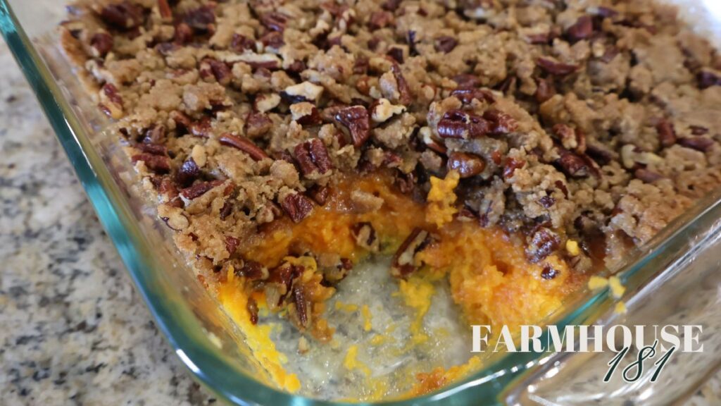 scoop of sweet potato casserole removed from pan
