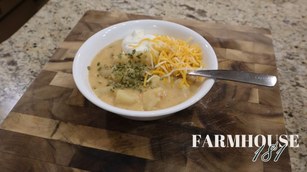 potato soup in bowl with toppings