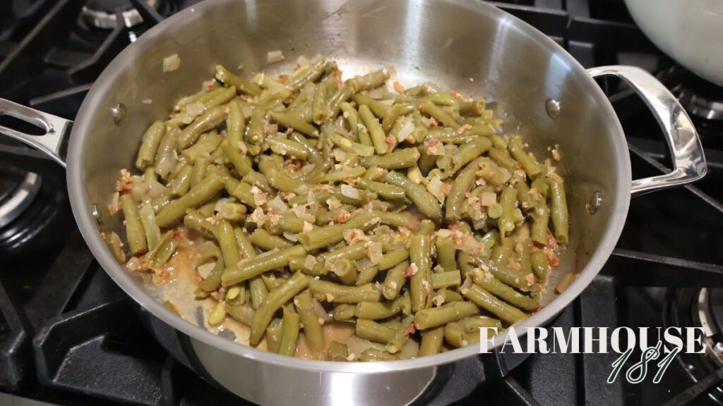 green beans, onion, garlic and bacon in the skillet