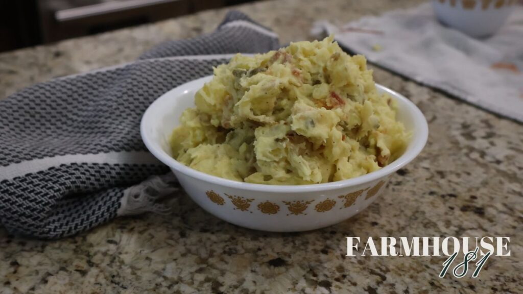 potato salad recipe with pickles and bacon in bowl