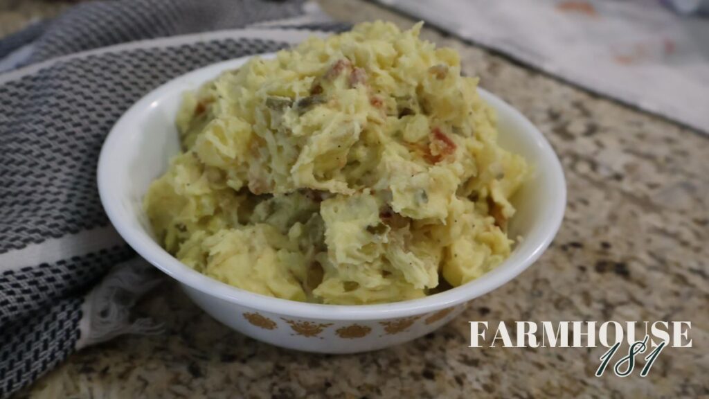 potato salad recipe with bacon and pickles in bowl