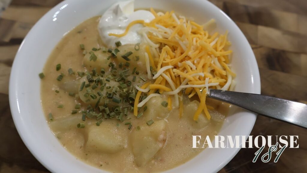 zoomed in picture of potato soup in bowl with toppings